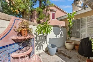 a view of a porch with furniture and a potted plant