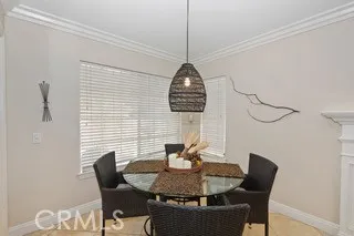 a dining room with furniture and window