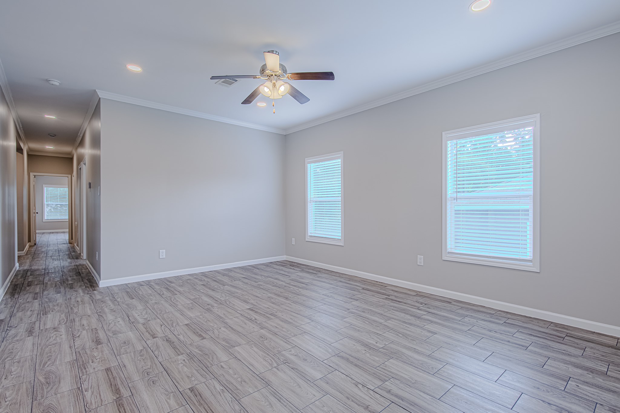 778 Pickering Street Houston, TX 77091 - Photo 11 of 26 Secondary living or flex area with ceiling fan and windows overlooking the yard