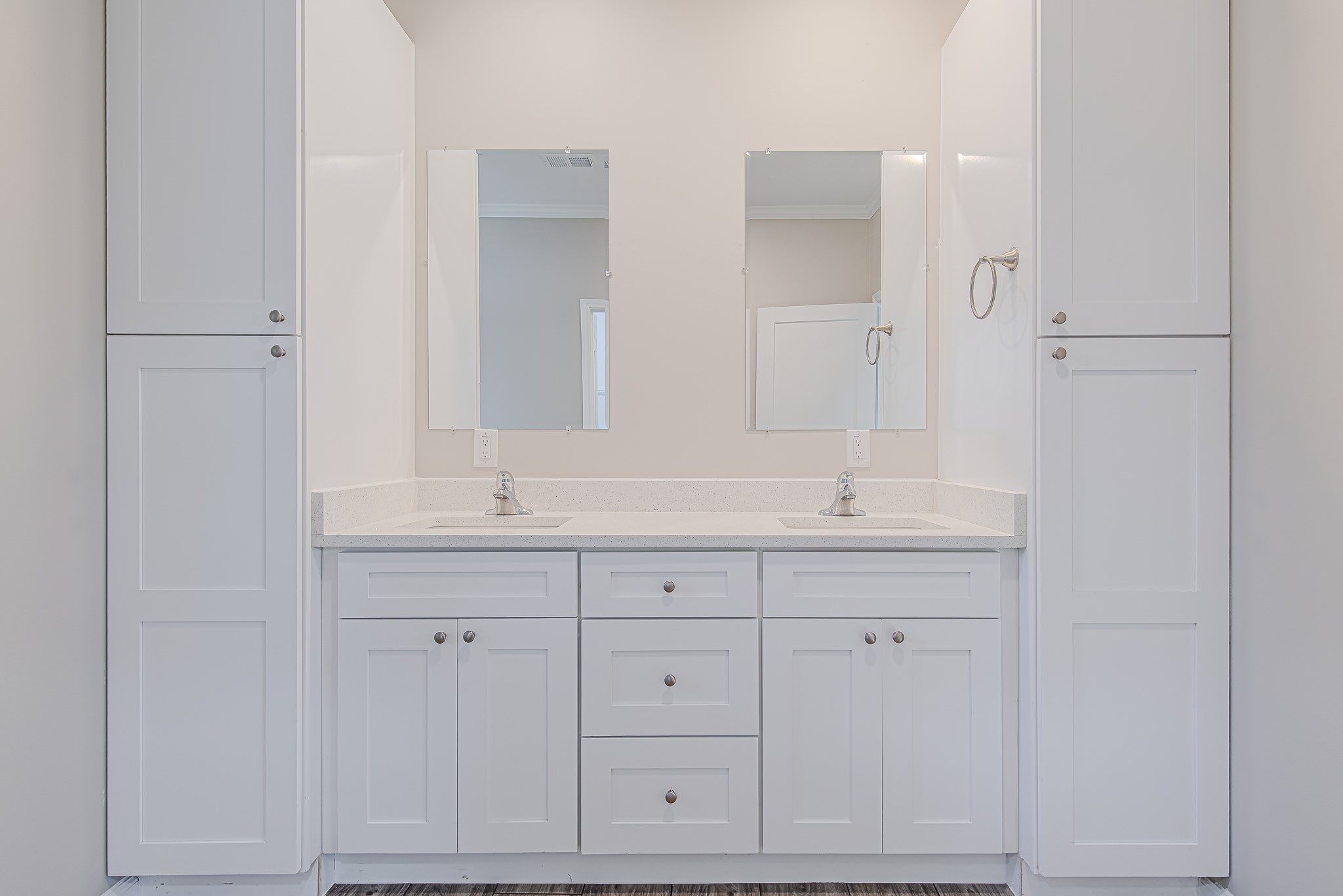 778 Pickering Street Houston, TX 77091 - Photo 16 of 26 A front-facing view of the primary bathroom vanity with dual mirrors and storage