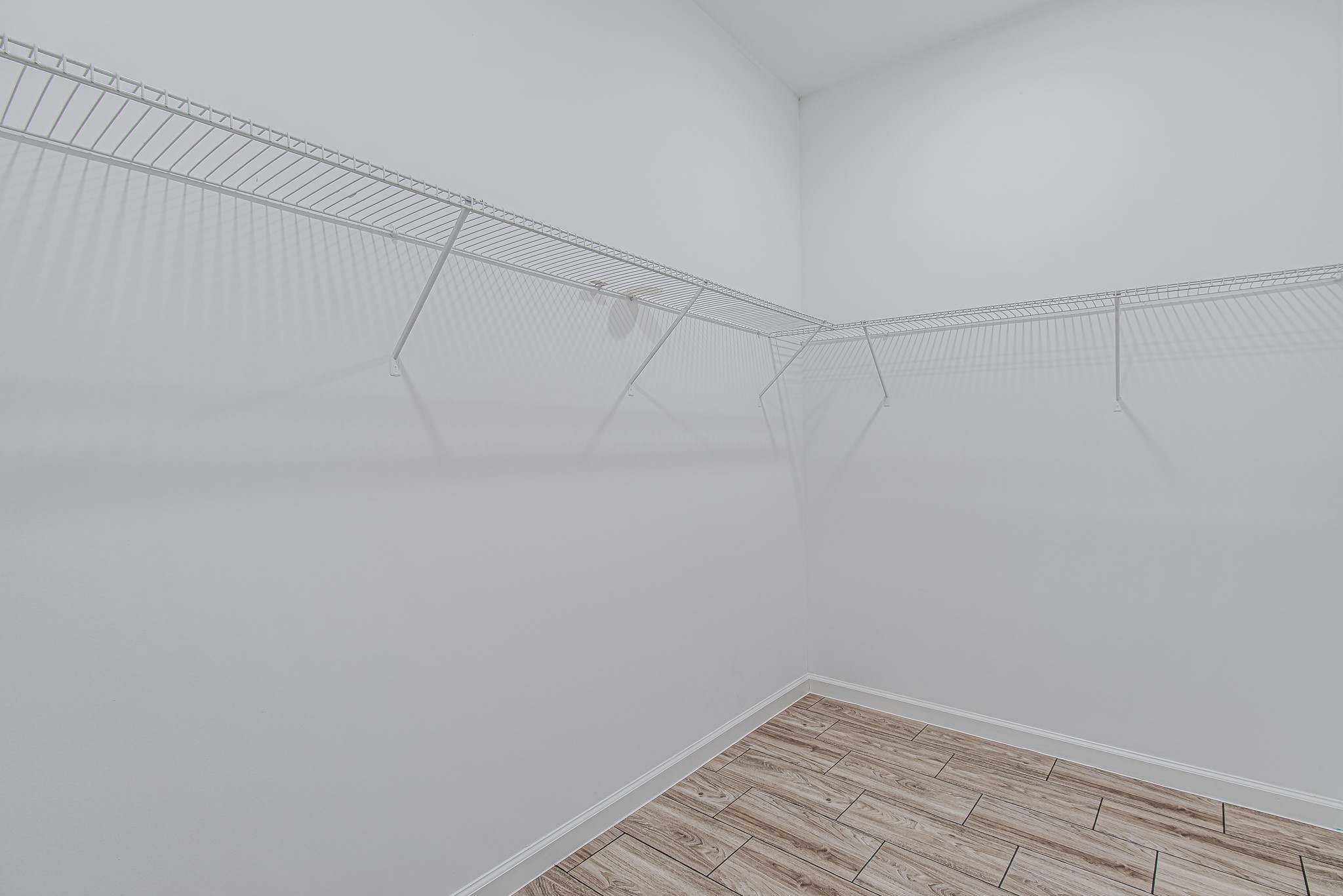 778 Pickering Street Houston, TX 77091 - Photo 19 of 26 Large walk-in closet offering plenty of hanging and shelf space