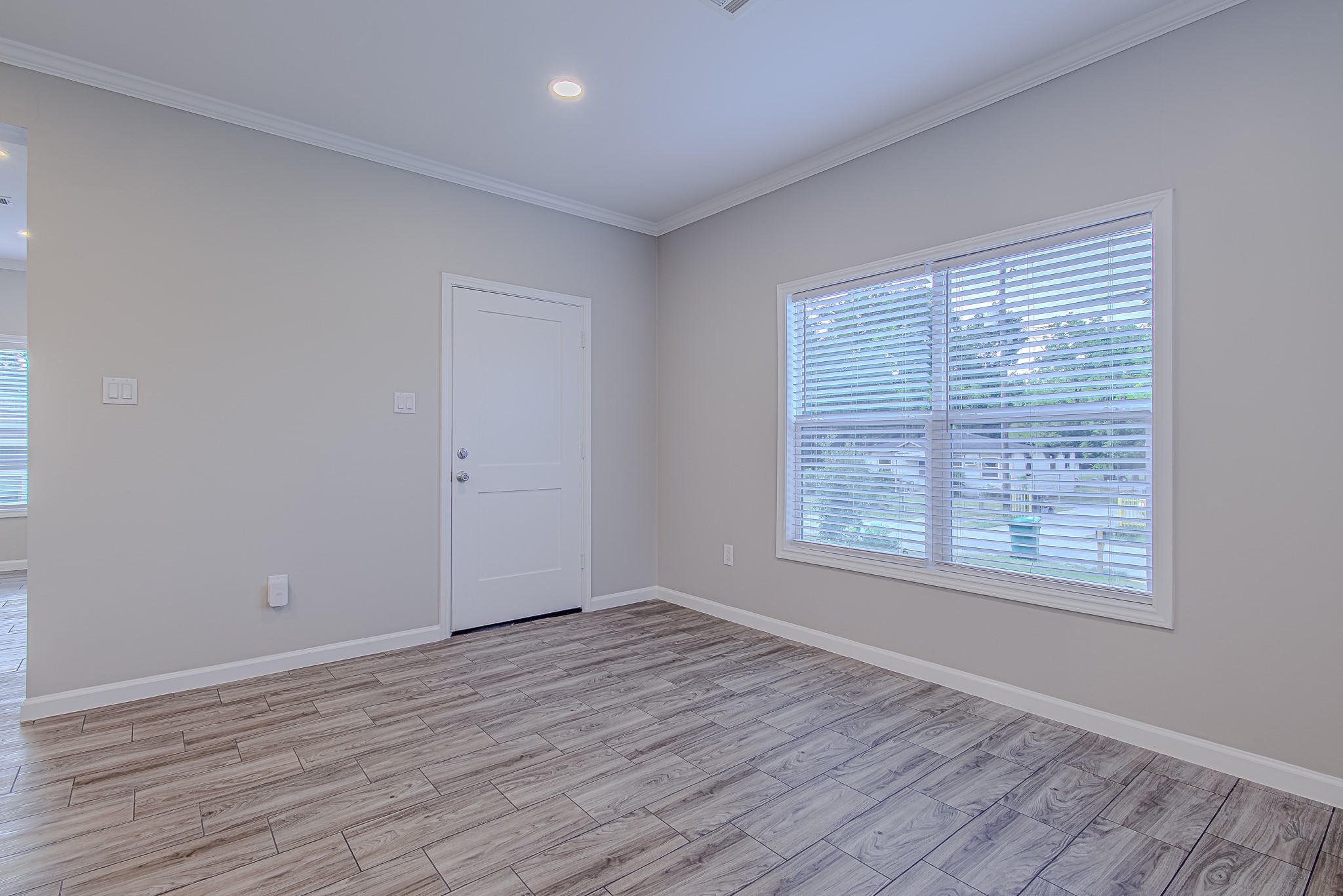 778 Pickering Street Houston, TX 77091 - Photo 3 of 26 Bright front room with a large window that fills the space with natural light