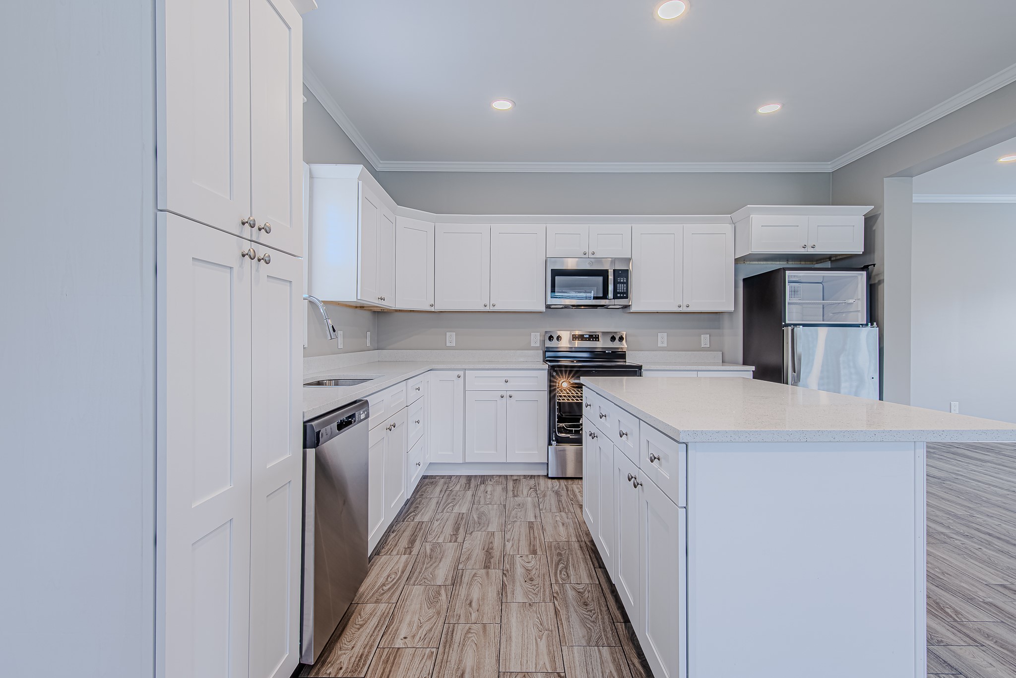 778 Pickering Street Houston, TX 77091 - Photo 7 of 26 Kitchen detail shot showing granite counters, stainless steel appliances, and sleek cabinetry