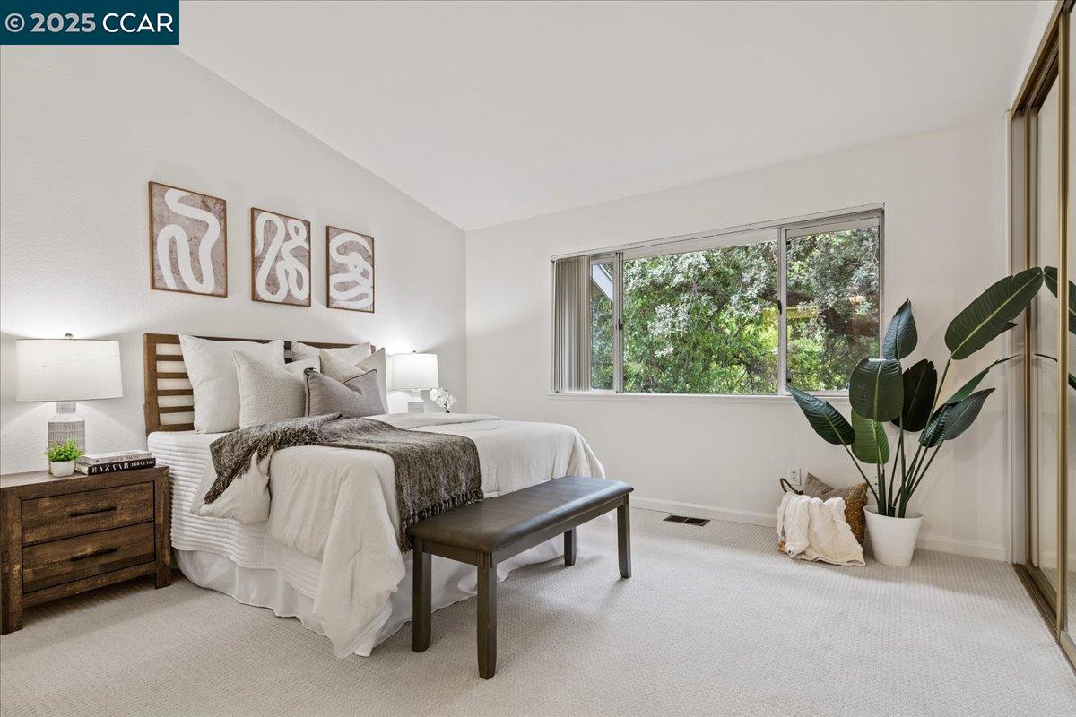 2606 Jones Road, Unit B Walnut Creek, CA 94597 - Photo 16 of 29 a bedroom with furniture and a large window
