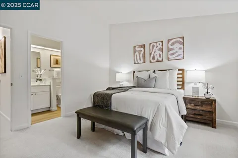 a bedroom with a bed and a table