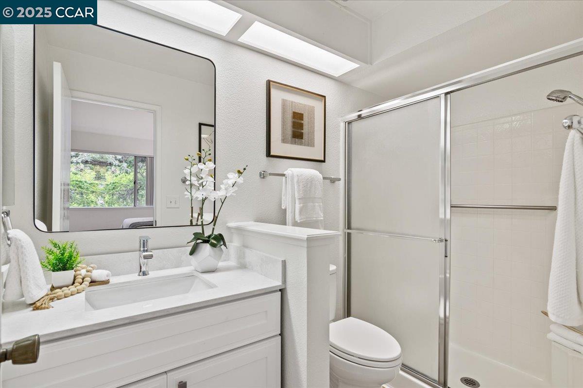 2606 Jones Road, Unit B Walnut Creek, CA 94597 - Photo 19 of 29 a bathroom with a sink toilet and shower