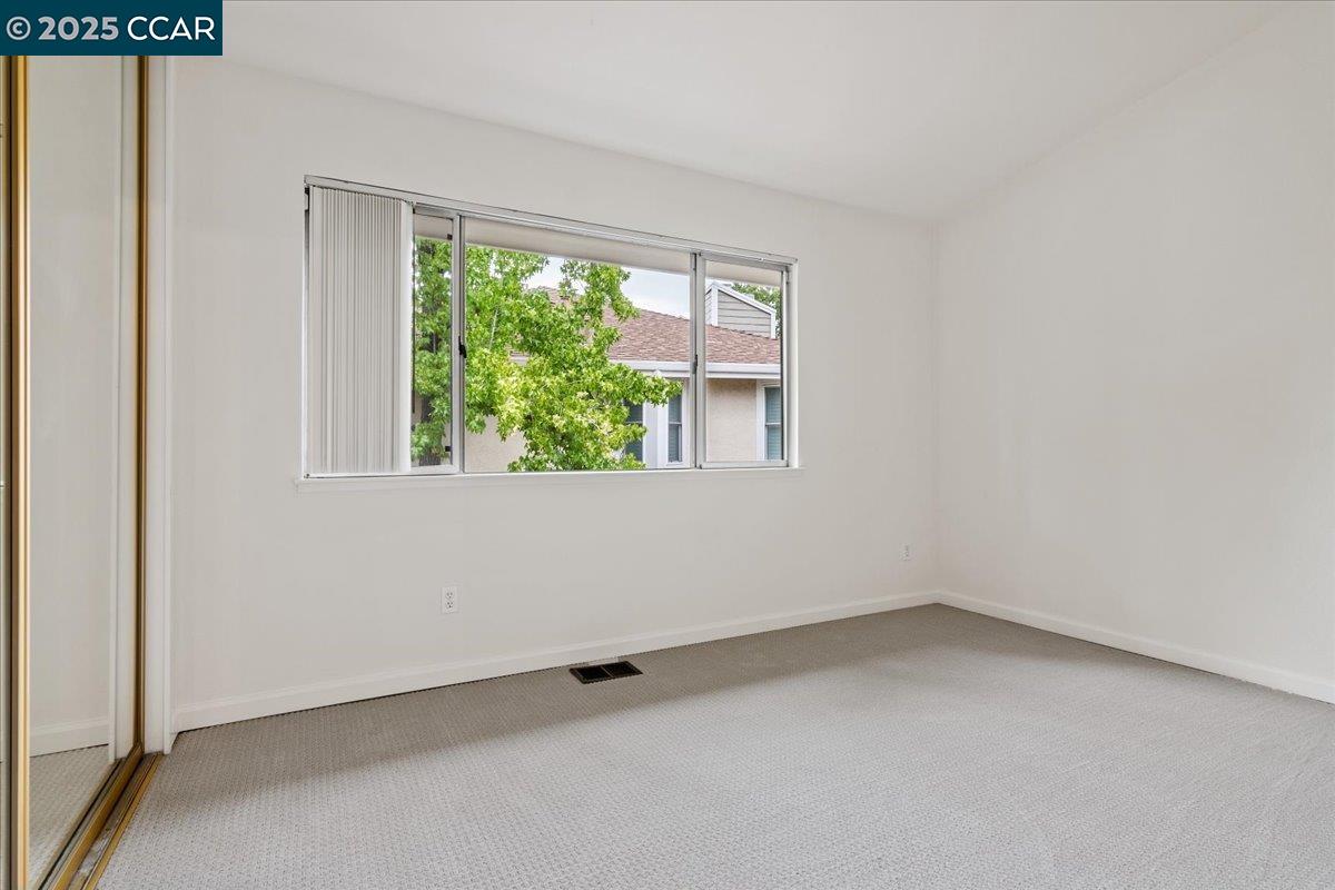 2606 Jones Road, Unit B Walnut Creek, CA 94597 - Photo 20 of 29 an empty room with a window