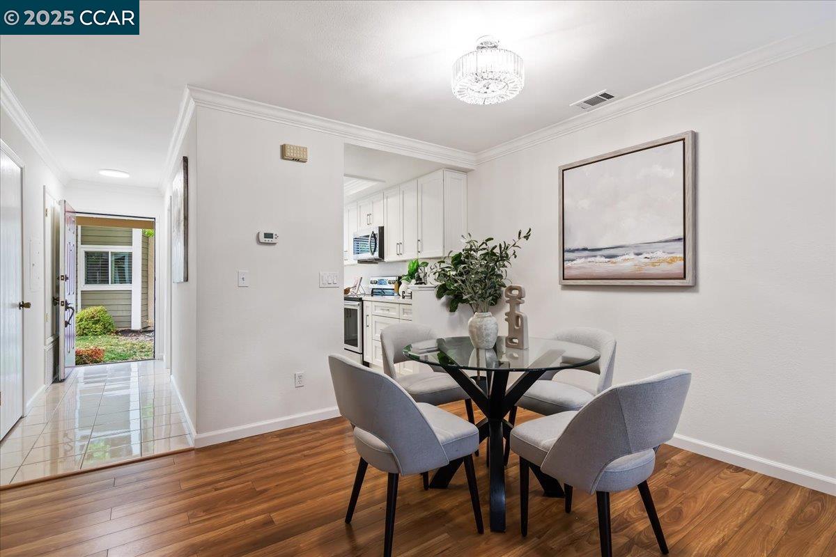 2606 Jones Road, Unit B Walnut Creek, CA 94597 - Photo 3 of 29 a view of a dining room with furniture and wooden floor