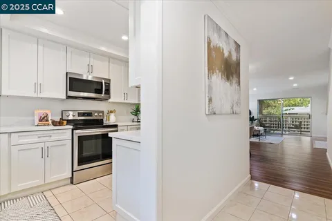 a kitchen with a stove and a microwave