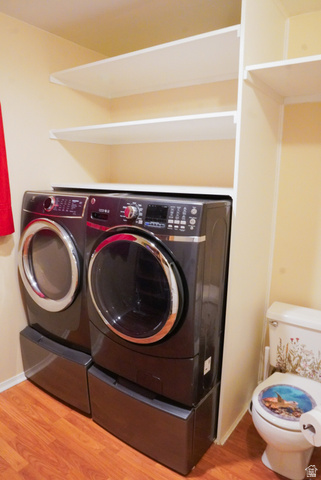 324 Stringtown Road Georgetown, ID 83239 - Photo 23 of 49 Laundry room with light wood-style flooring and separate washer and dryer