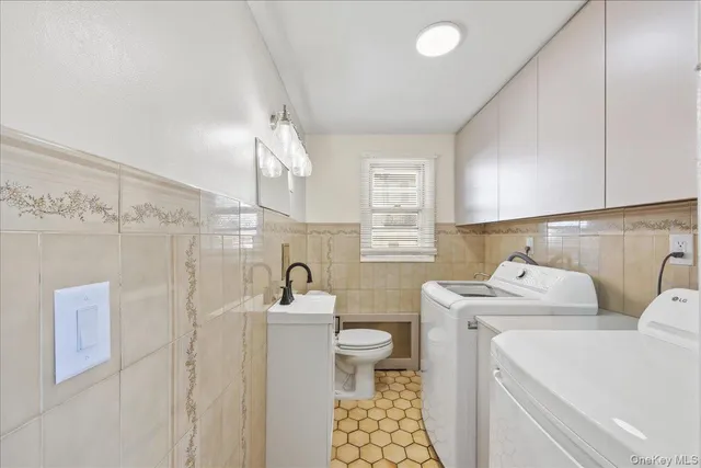 a bathroom with a sink a toilet and shower curtain