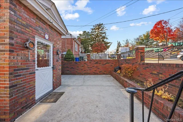 a view of a patio with a yard