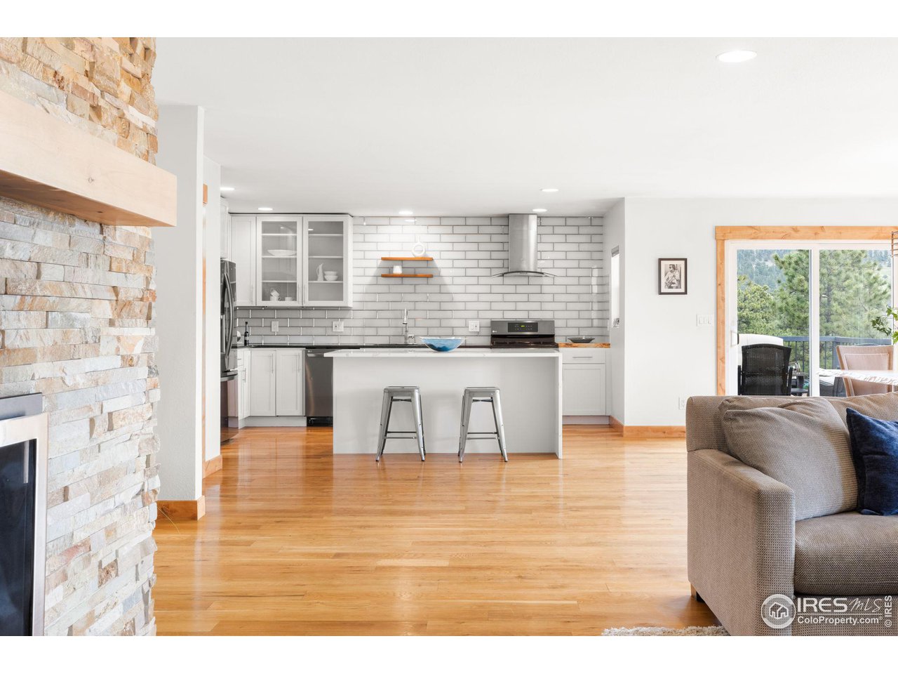 801 Kelly Road West Boulder, CO 80302 - Photo 12 of 33 a living room with stainless steel appliances kitchen island granite countertop furniture and a large window
