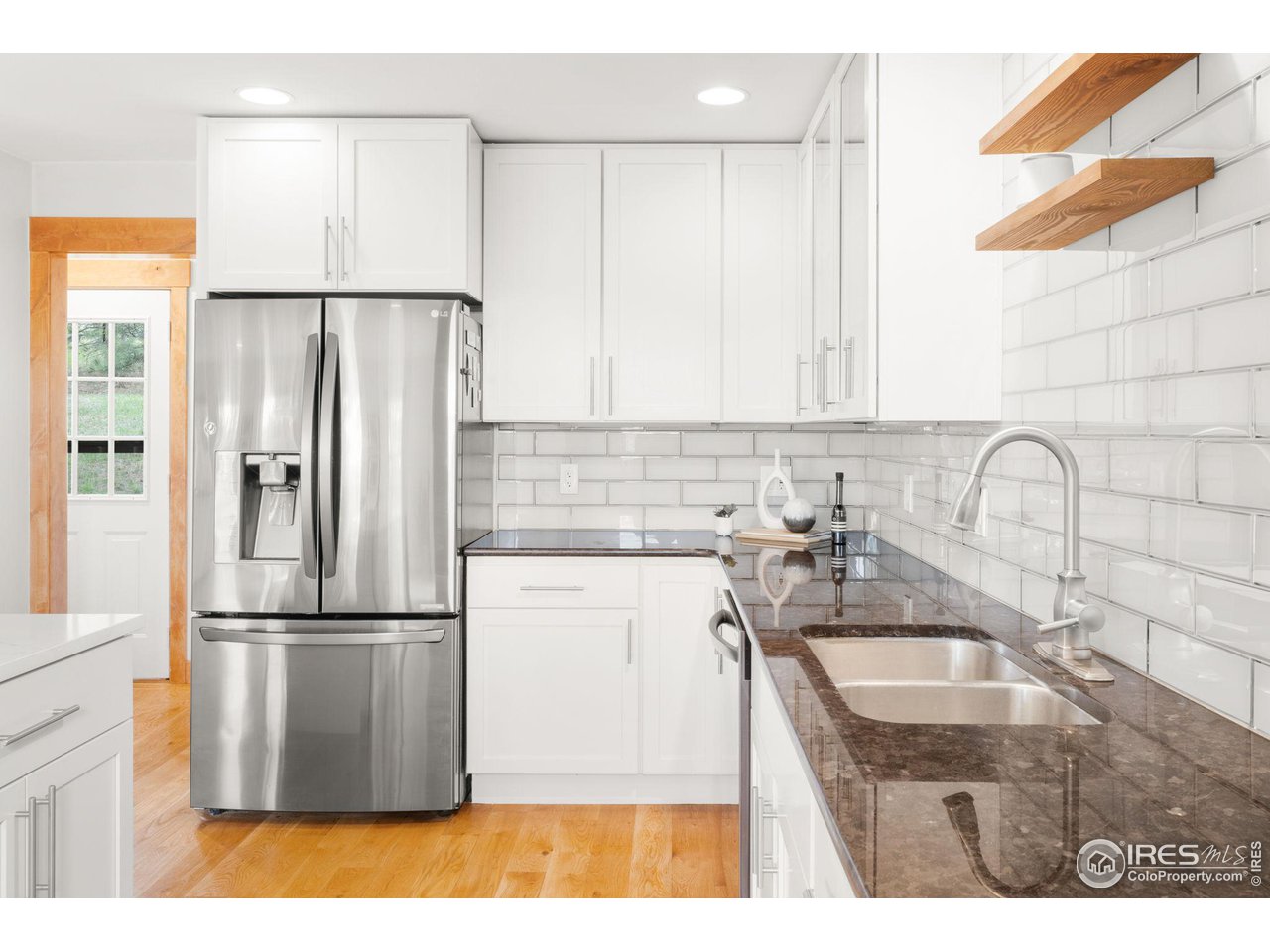 801 Kelly Road West Boulder, CO 80302 - Photo 14 of 33 a kitchen with a sink a refrigerator and a sink