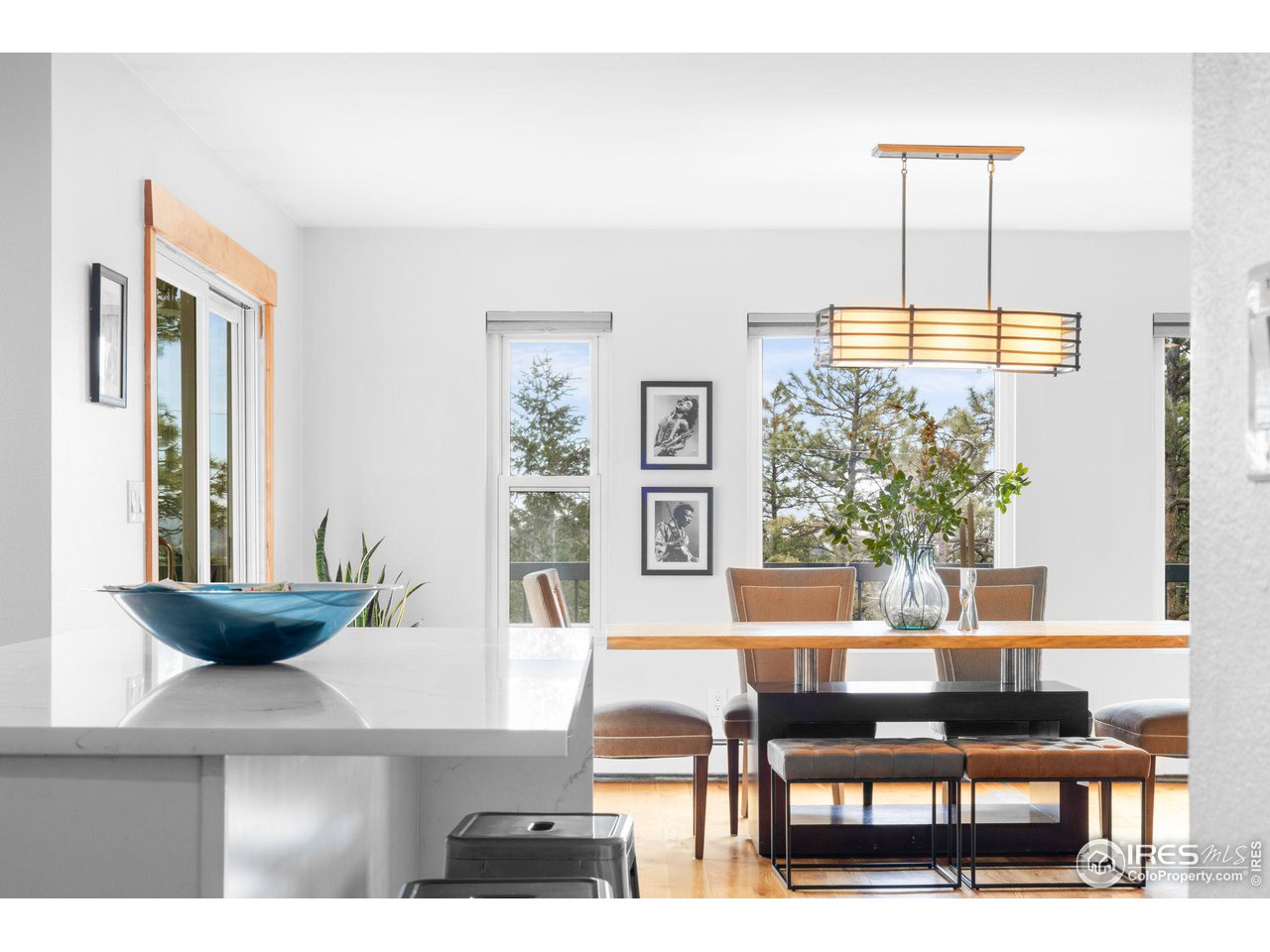 801 Kelly Road West Boulder, CO 80302 - Photo 17 of 33 a view of a dining room with furniture and wooden floor