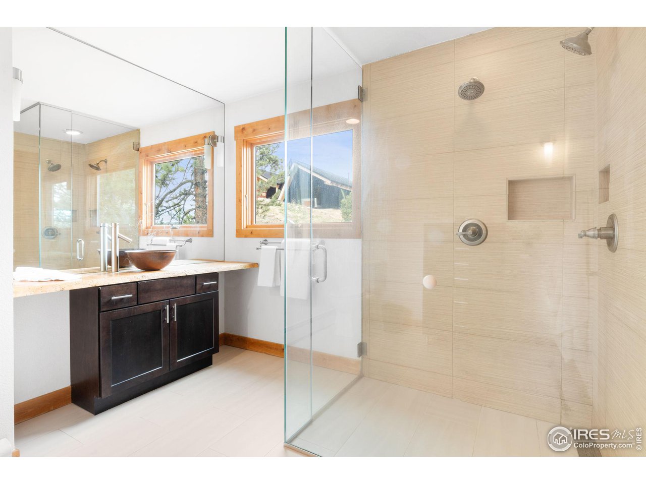 801 Kelly Road West Boulder, CO 80302 - Photo 20 of 33 a large bathroom with a tub sink shower and mirror