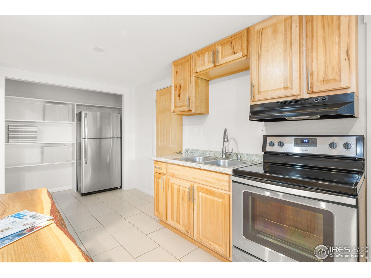 801 Kelly Road West Boulder, CO 80302 - Photo 29 of 33 a kitchen with stainless steel appliances granite countertop a refrigerator and a stove top oven