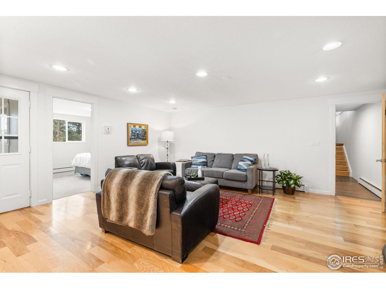 801 Kelly Road West Boulder, CO 80302 - Photo 31 of 33 a living room with furniture and a wooden floor