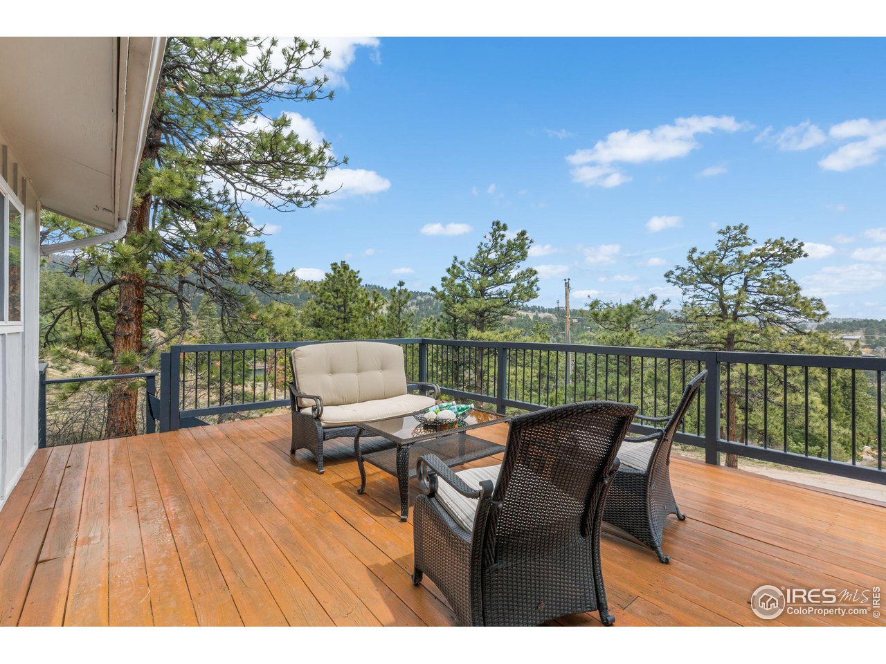 801 Kelly Road West Boulder, CO 80302 - Photo 9 of 33 a view of a chairs and table on the wooden floor