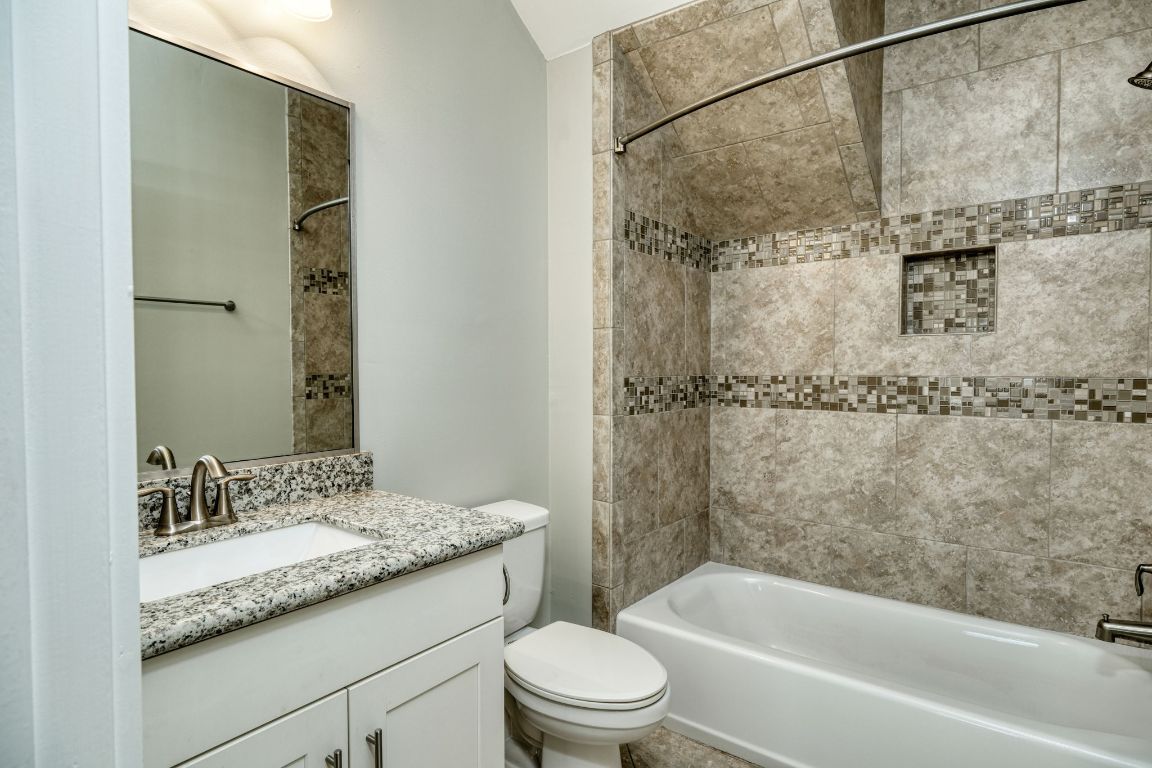 605 Pecan Avenue, Unit 3 Round Rock, TX 78664 - Photo 7 of 15 Full bathroom with washtub / shower combination and vanity