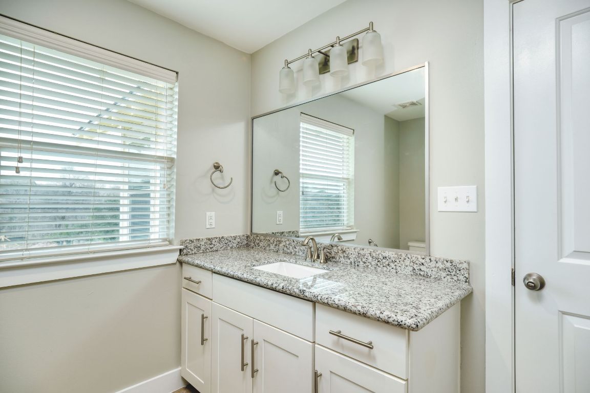 605 Pecan Avenue, Unit 3 Round Rock, TX 78664 - Photo 10 of 15 Bathroom featuring vanity and toilet