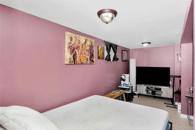 a room with furniture and a flat screen tv