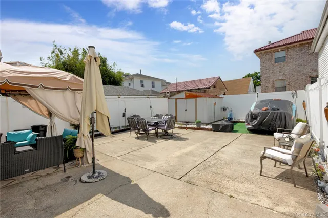 a view of backyard with wheel chair potted plants and outdoor seating