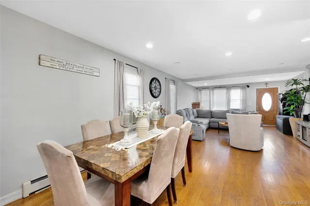 a living room with fireplace furniture and wooden floor