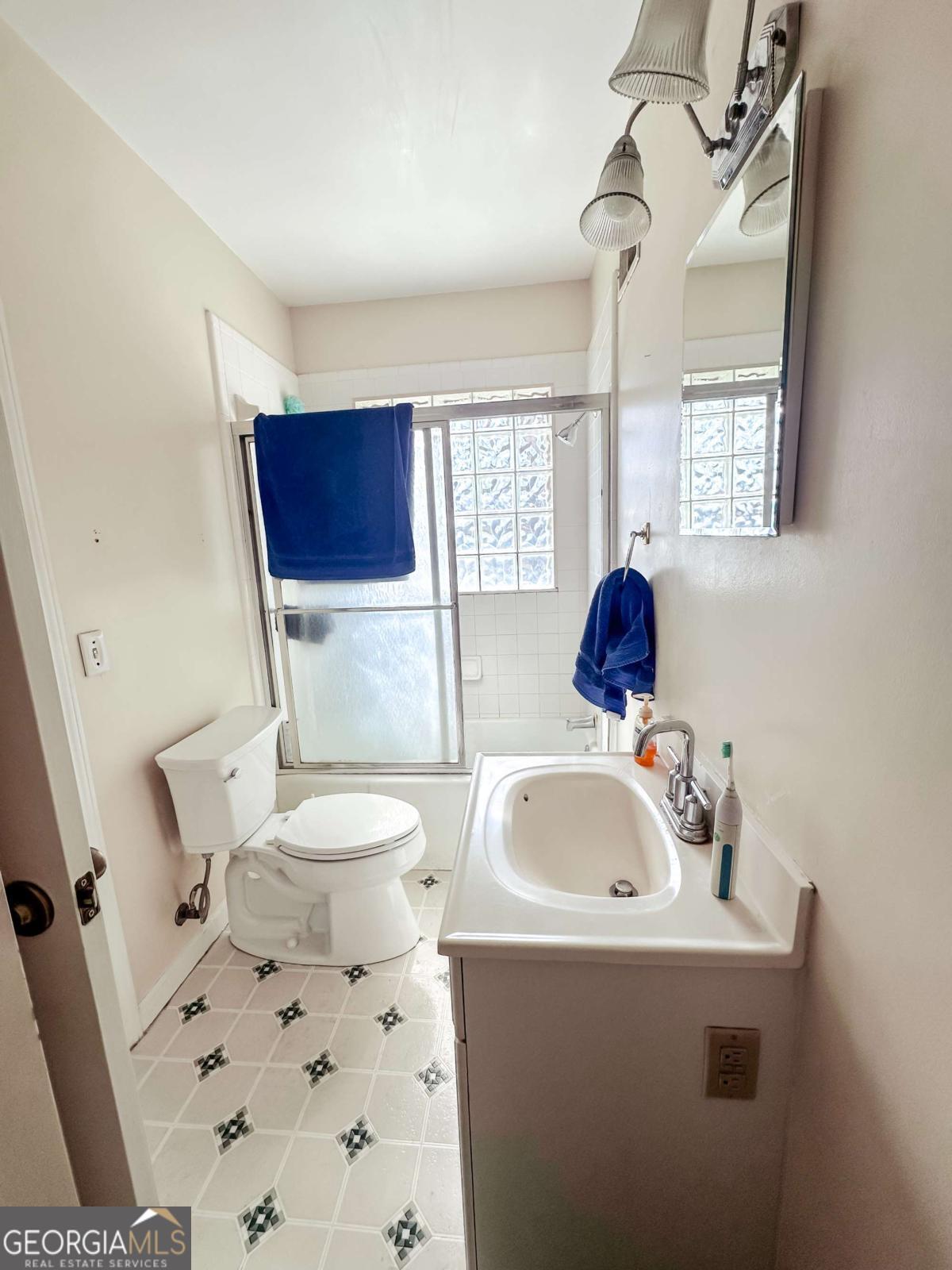 1106 Mt Vernon Road Vidalia, GA 30474 - Photo 12 of 24 a bathroom with a sink toilet and shower