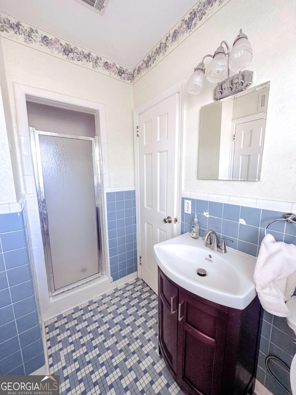 1106 Mt Vernon Road Vidalia, GA 30474 - Photo 17 of 24 a bathroom with a sink and a mirror