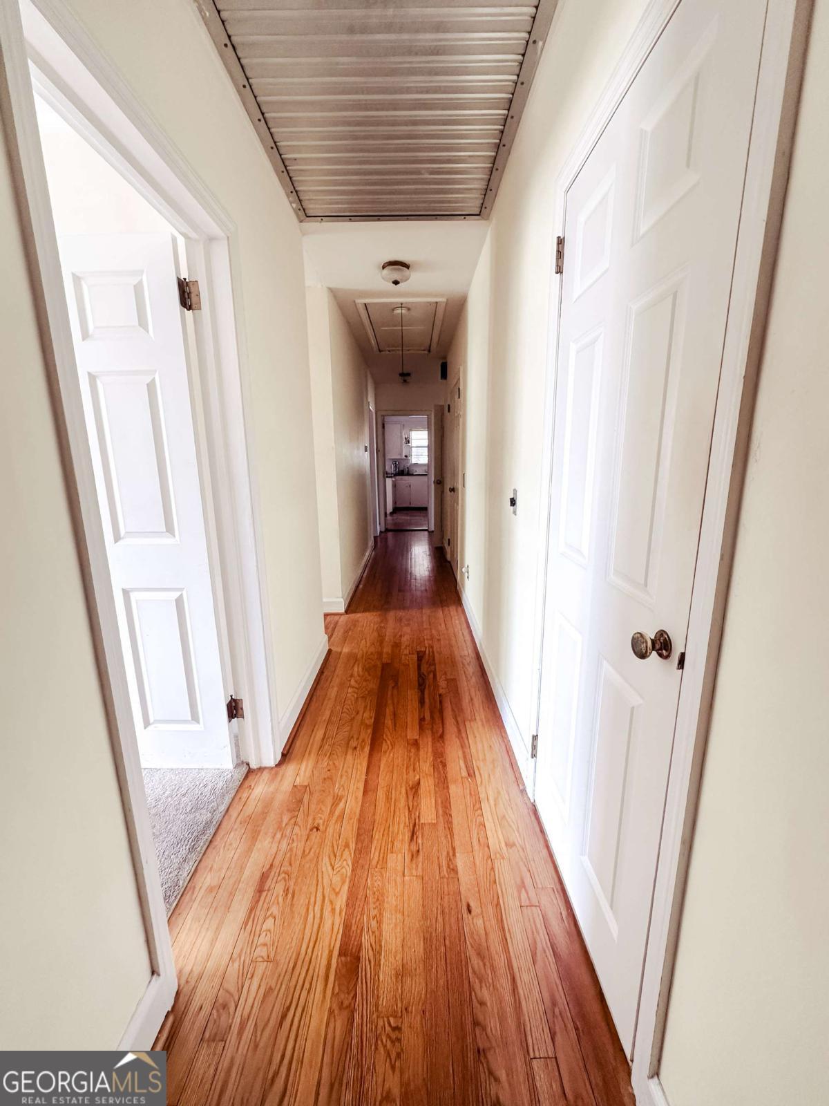 1106 Mt Vernon Road Vidalia, GA 30474 - Photo 18 of 24 a view of a hallway with wooden floor and staircase
