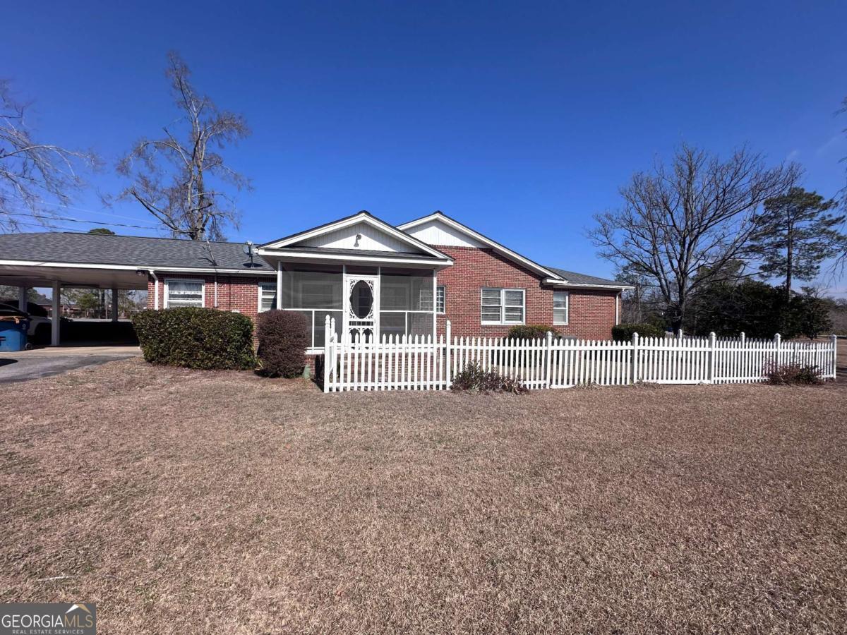 1106 Mt Vernon Road Vidalia, GA 30474 - Photo 20 of 24 a front view of a house with a garden