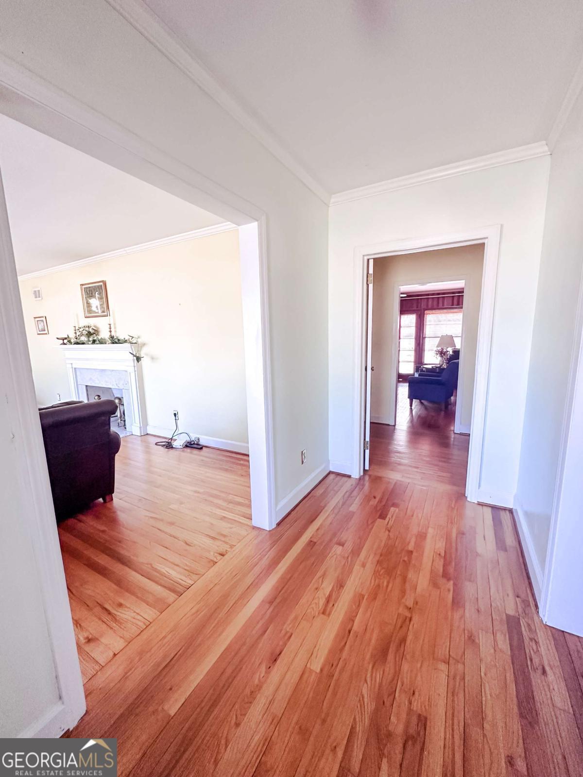 1106 Mt Vernon Road Vidalia, GA 30474 - Photo 2 of 24 a bedroom with wooden floor and furniture