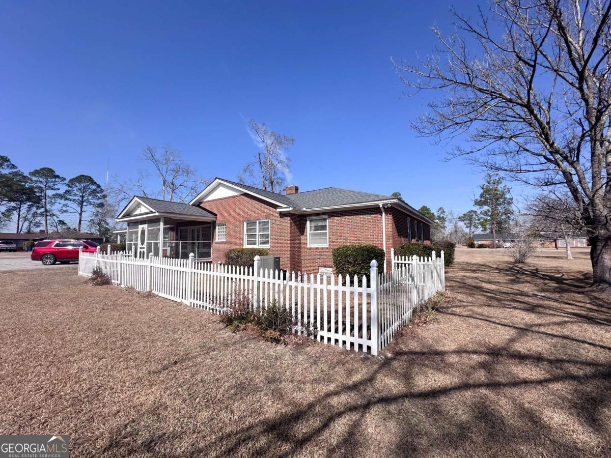 1106 Mt Vernon Road Vidalia, GA 30474 - Photo 22 of 24 a front view of a house with a yard