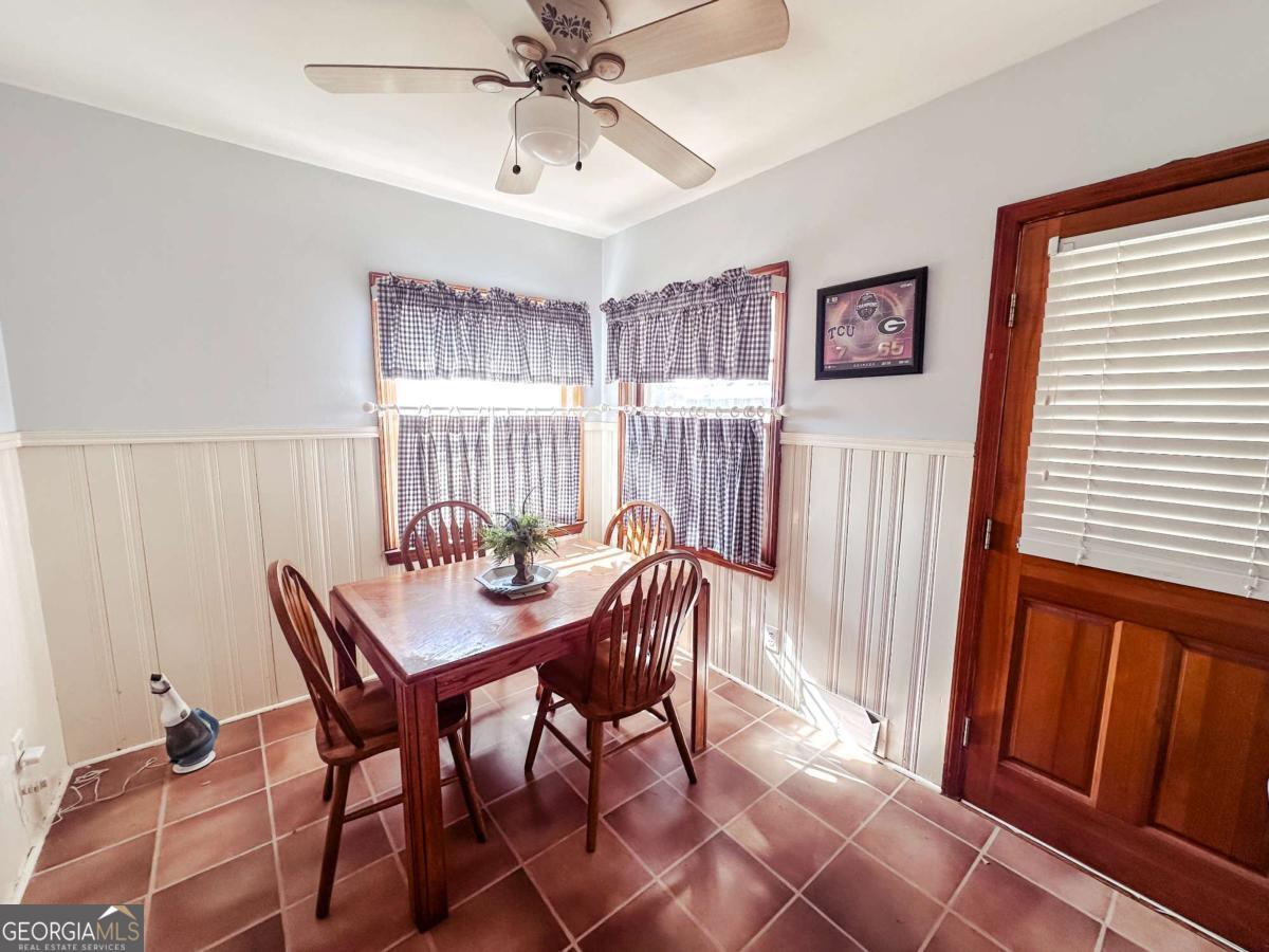 1106 Mt Vernon Road Vidalia, GA 30474 - Photo 9 of 24 a view of a dining room with furniture and a window