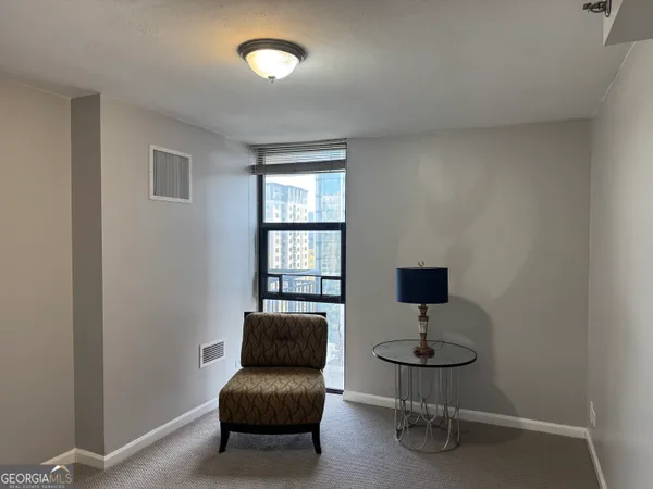 a living room with furniture and a window