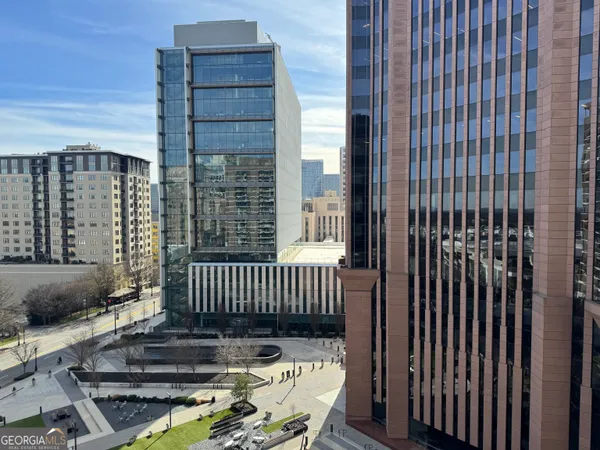 a view of balcony with wooden fence