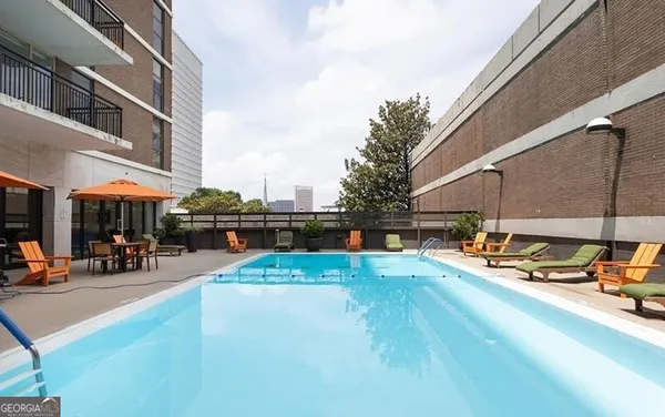 a view of a swimming pool with a patio