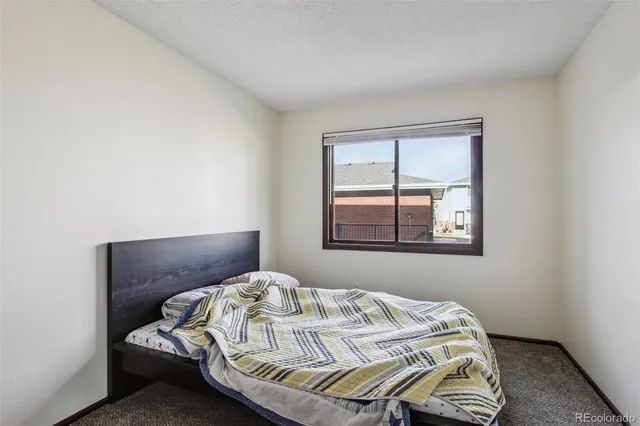 a view of a dining room with furniture and window