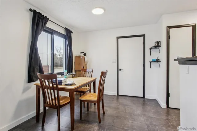a view of livingroom with furniture and a window