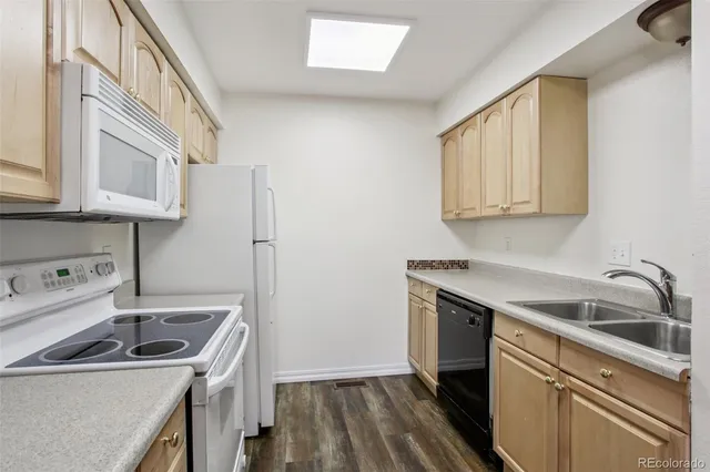 a bathroom with a toilet sink and shower