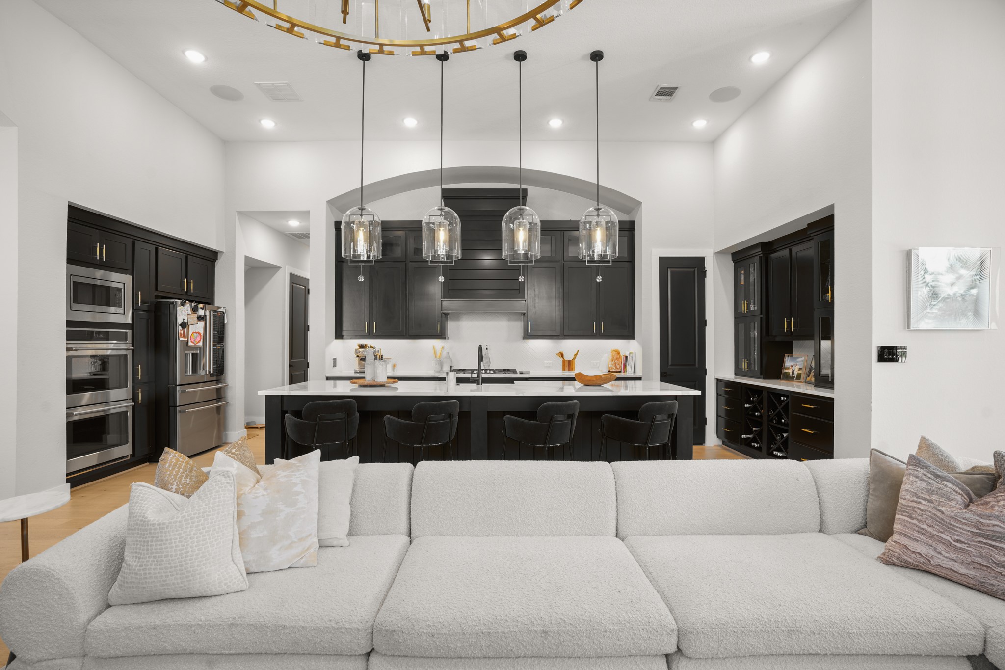 154 LITTLE Strm Cove Austin, TX 78737 - Photo 37 of 37 Gleaming hardwood floors and a spacious island anchor this modern open-concept culinary space with open floorplan concept