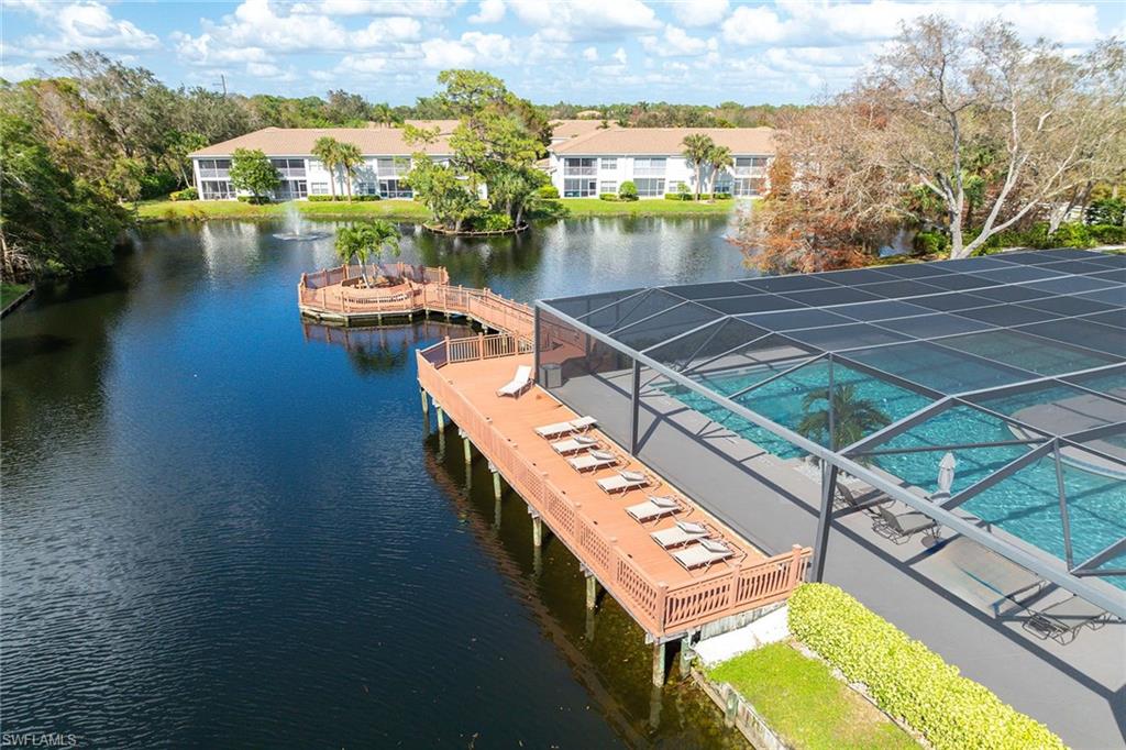 6834 Lantana Bridge Road, Unit 101 Naples, FL 34109 - Photo 11 of 50 an aerial view of a city with lake view