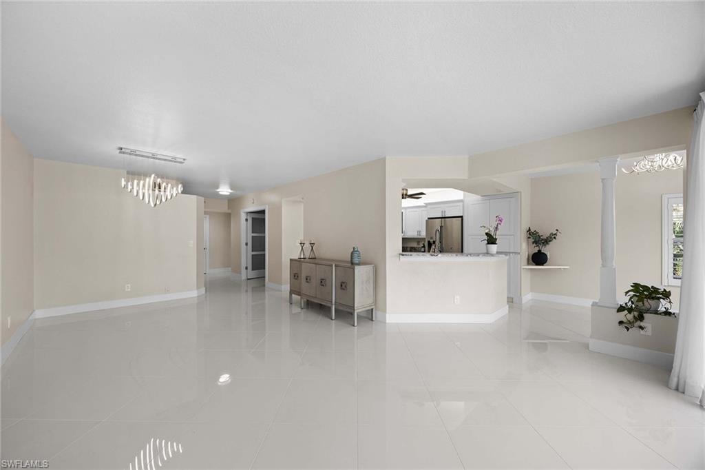 6834 Lantana Bridge Road, Unit 101 Naples, FL 34109 - Photo 18 of 50 a view of a livingroom and a kitchen