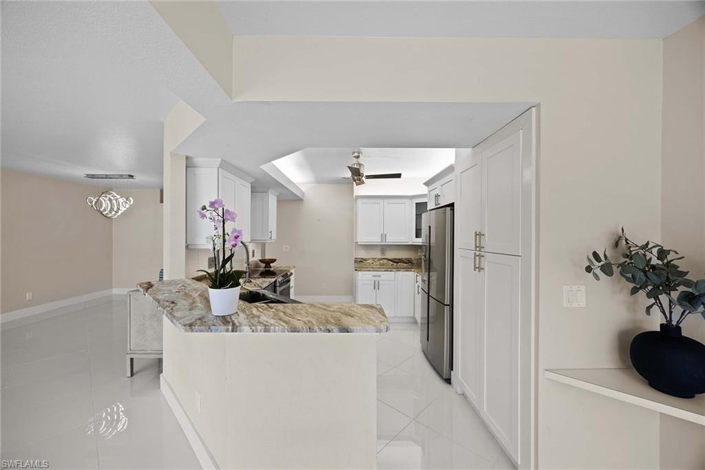 6834 Lantana Bridge Road, Unit 101 Naples, FL 34109 - Photo 20 of 50 a view of a kitchen and living room