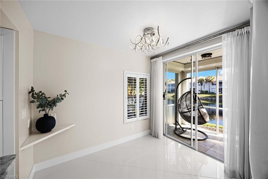 6834 Lantana Bridge Road, Unit 101 Naples, FL 34109 - Photo 24 of 50 a view of a room with gym equipment