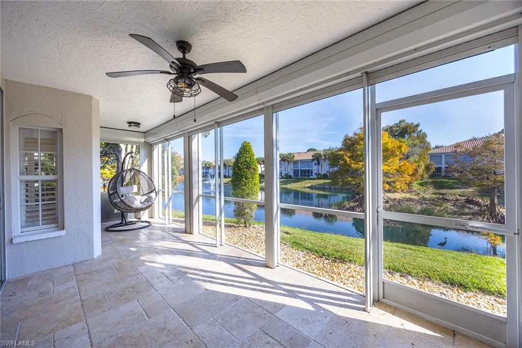 6834 Lantana Bridge Road, Unit 101 Naples, FL 34109 - Photo 26 of 50 a view of a porch with a floor to ceiling window and an outdoor space