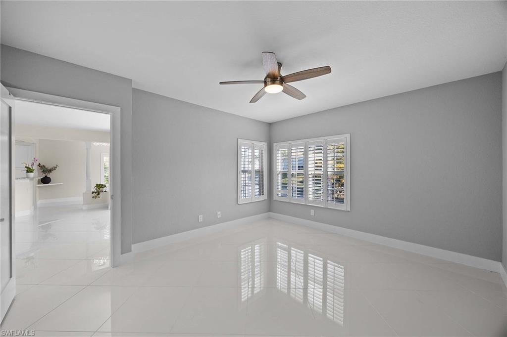 6834 Lantana Bridge Road, Unit 101 Naples, FL 34109 - Photo 29 of 50 a view of an empty room with a window
