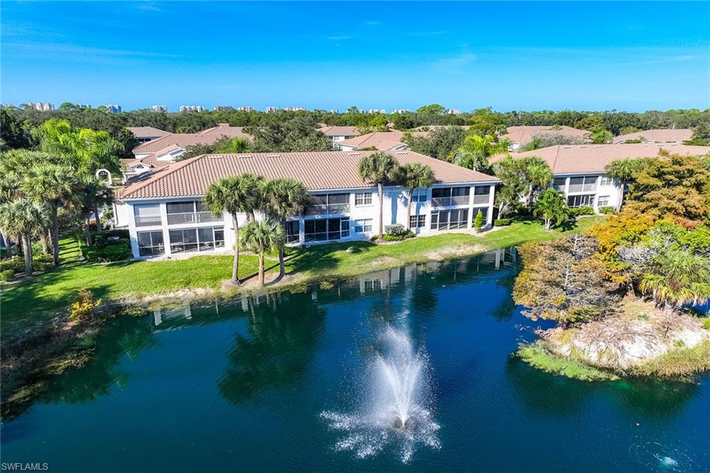 6834 Lantana Bridge Road, Unit 101 Naples, FL 34109 - Photo 45 of 50 front view of a house with a yard