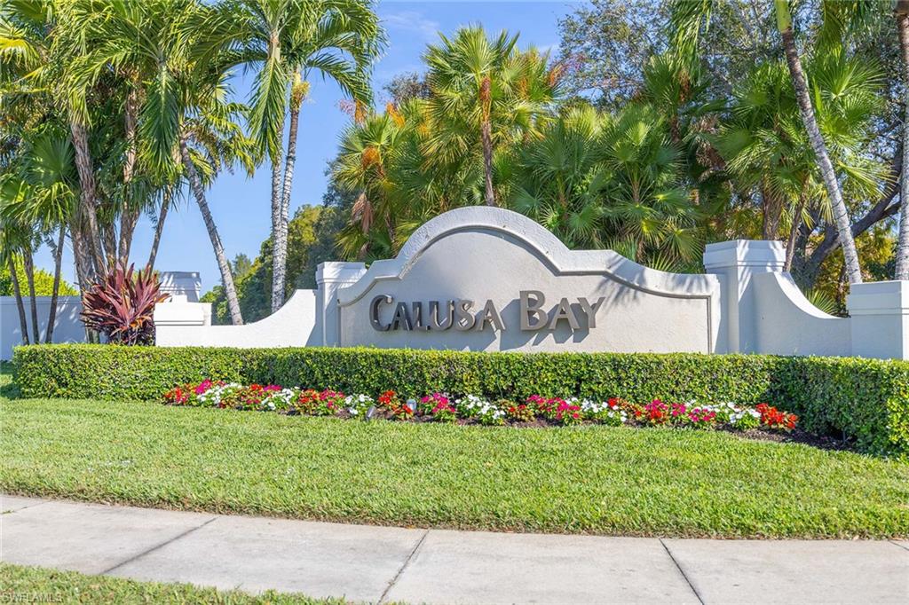 6834 Lantana Bridge Road, Unit 101 Naples, FL 34109 - Photo 48 of 50 a front view of a house with a garden